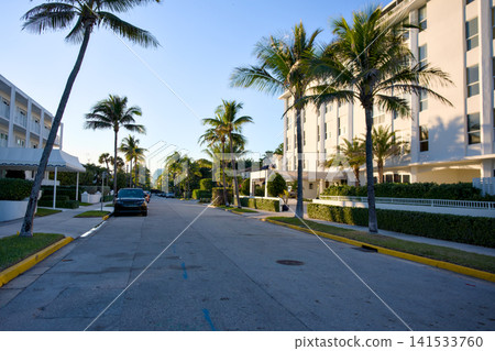 Quiet Palm Beach Street With Parked Cars And Condo Buildings 141533760