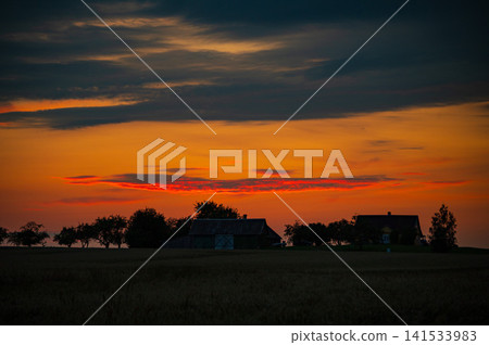 Golden Sunset Over Rural Farmland and Countryside Landscape Golden Sunset Over Rural Farmland and Countryside Landscape 141533983