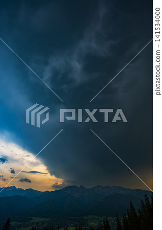 Dramatic Cumulonimbus Storm Clouds Above Mountain Forest 141534000