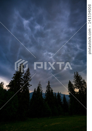 Dramatic Mammatus Clouds Above Mountain Forest Before Storm 141534008