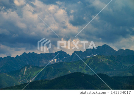 Dramatic Cumulonimbus Storm Clouds Above Mountain Forest Dramatic Cumulonimbus Storm Clouds Above Mountain Forest 141534017