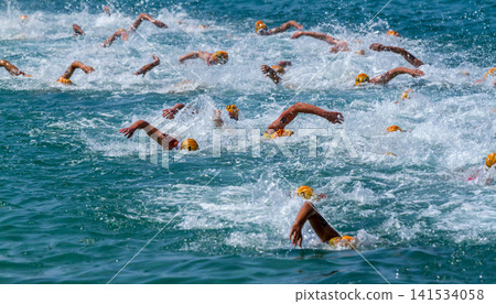 Open Water Swim Race with Athletes in Ocean Waves Open Water Swim Race with Athletes in Ocean Waves 141534058