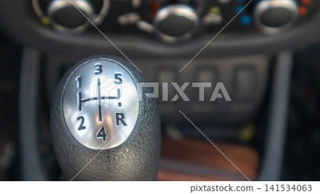 Manual Gear Shift Knob in Car Interior Close-Up Manual Gear Shift Knob in Car Interior Close-Up 141534063