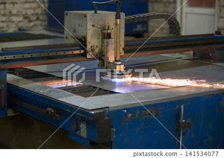 CNC Plasma Cutting Machine Cutting Metal Sheet in Factory CNC Plasma Cutting Machine Cutting Metal Sheet in Factory 141534077