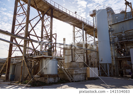Industrial Plant with Pipes, Steel Structures, and Storage Tanks Industrial Plant with Pipes, Steel Structures, and Storage Tanks 141534083