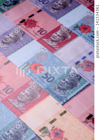 Malaysian ringgit banknotes as a tool for trade and financial transactions. The Malaysian ringgit Malaysian ringgit banknotes as a tool for trade and financial transactions. The Malaysian ringgit 141534361