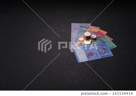 Malaysian ringgit banknotes as a tool for trade and financial transactions. The Malaysian ringgit Malaysian ringgit banknotes as a tool for trade and financial transactions. The Malaysian ringgit 141534414