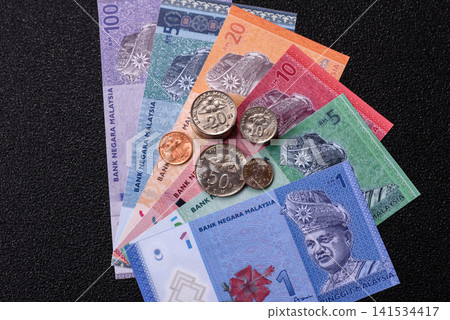 Malaysian ringgit banknotes as a tool for trade and financial transactions. The Malaysian ringgit Malaysian ringgit banknotes as a tool for trade and financial transactions. The Malaysian ringgit 141534417