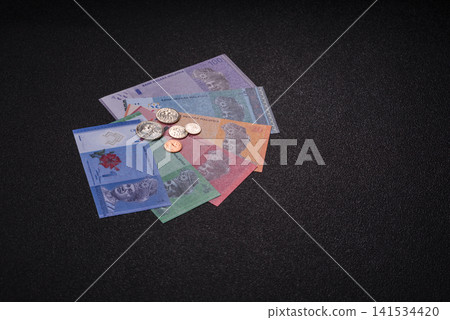 Malaysian ringgit banknotes as a tool for trade and financial transactions. The Malaysian ringgit Malaysian ringgit banknotes as a tool for trade and financial transactions. The Malaysian ringgit 141534420