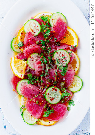 Sicilian tuna crudo, on a white plate, Italian dish, homemade, no people, Sicilian tuna crudo, on a white plate, Italian dish, homemade, no people, 141534447