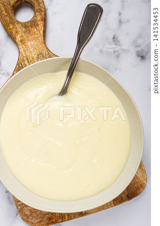 Mashed potatoes, with suluguni cheese, homemade, on a marble table, no people, top view, Mashed potatoes, with suluguni cheese, homemade, on a marble table, no people, top view, 141534453