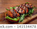 sandwich with duck breast and arugula, balsamic sauce, on a wooden chopping board, breakfast, homemade, without people, 141534478
