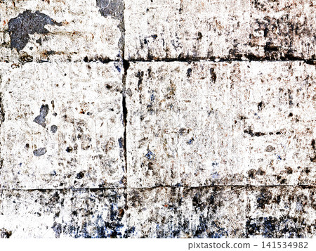 Close-up of aged grunge texture of light stonework with cracks and abrasions. 141534982
