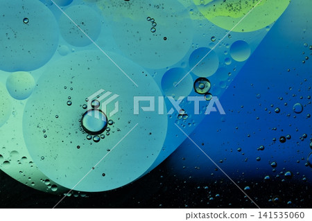 Oil drops on water surface creating colorful abstract texture Oil drops on water surface creating colorful abstract texture 141535060