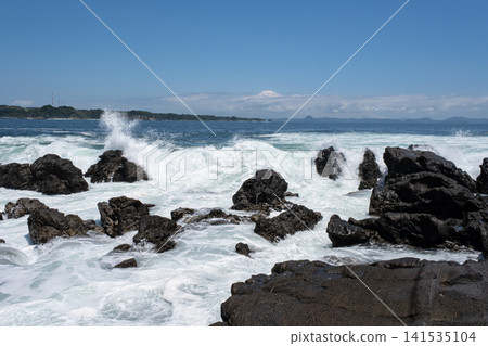 Rough waves crashing against the rocks of Jogashima Island on the Miura Peninsula, creating a sea spray. Rough waves crashing against the rocks of Jogashima Island on the Miura Peninsula, creating a sea spray. 141535104