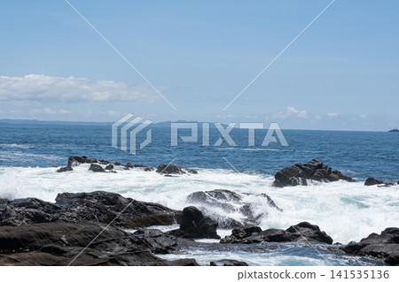 Rough waves crashing against the rocks of Jogashima Island on the Miura Peninsula, creating a sea spray. Rough waves crashing against the rocks of Jogashima Island on the Miura Peninsula, creating a sea spray. 141535136