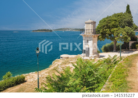 Scenic coastal view with historic lighthouse in Rovinj, Croatia. Scenic coastal view with historic lighthouse in Rovinj, Croatia. 141535227