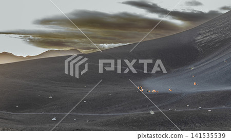 Panoramic view of tourists volcano boarding down Cerro Negro volcano. Tourists volcano boarding down the slopes of Cerro Negro volcano Panoramic view of tourists volcano boarding down Cerro Negro volcano. Tourists volcano boarding down the slopes of Cerro Negro volcano 141535539