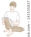 A man reading a book 141535837