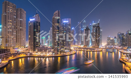 Beautiful aerial top view day to night transition timelapse of Dubai Marina canal Beautiful aerial top view day to night transition timelapse of Dubai Marina canal 141535993