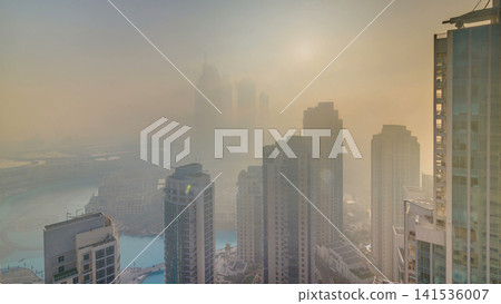 Foggy morning sunrise in downtown of Dubai timelapse. Foggy morning sunrise in downtown of Dubai timelapse. 141536007