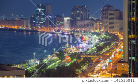 Dubai creek landscape day to night timelapse with boats and ship near waterfront Dubai creek landscape day to night timelapse with boats and ship near waterfront 141536011