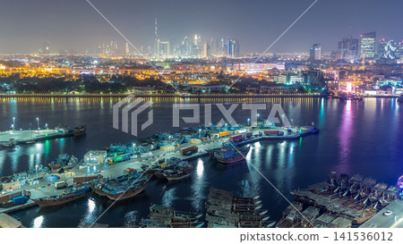 Dubai creek landscape day to night timelapse with boats and ship near waterfront Dubai creek landscape day to night timelapse with boats and ship near waterfront 141536012
