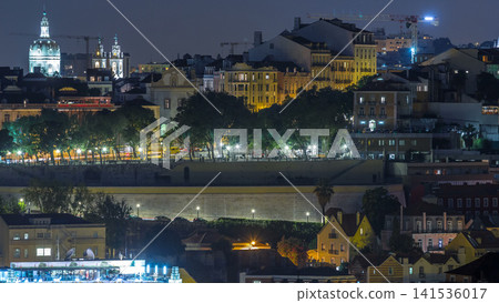 Lisbon panorama after sunset aerial view of city centre with red roofs at autumn day to night timelapse, Portugal Lisbon panorama after sunset aerial view of city centre with red roofs at autumn day to night timelapse, Portugal 141536017