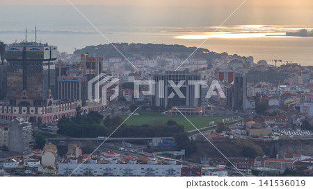 Panoramic overview during sunrise over Lisbon from a viewpoint in Monsanto morning timelapse. 141536019