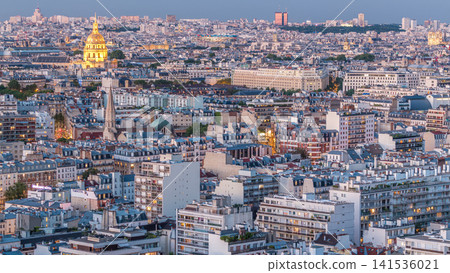 Aerial panorama above houses rooftops in a Paris day to night timelapse 141536021