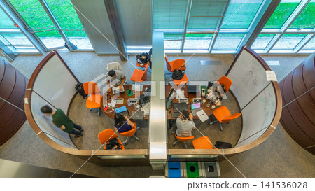 Young creative people in modern office timelapse. Group of young business people and students are working together Young creative people in modern office timelapse. Group of young business people and students are working together 141536028