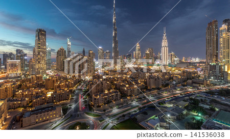 Dubai Downtown skyline day to night timelapse with Burj Khalifa and other towers panoramic view from the top in Dubai Dubai Downtown skyline day to night timelapse with Burj Khalifa and other towers panoramic view from the top in Dubai 141536038