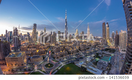 Dubai Downtown skyline day to night timelapse with Burj Khalifa and other towers panoramic view from the top in Dubai Dubai Downtown skyline day to night timelapse with Burj Khalifa and other towers panoramic view from the top in Dubai 141536039
