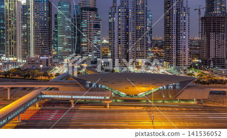 Aerial top view to Sheikh Zayed road near Dubai Marina and JLT day to night timelapse, Dubai. Aerial top view to Sheikh Zayed road near Dubai Marina and JLT day to night timelapse, Dubai. 141536052