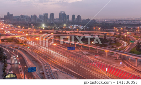 Aerial top view to Sheikh Zayed road near Dubai Marina and JLT night to day timelapse, Dubai. Aerial top view to Sheikh Zayed road near Dubai Marina and JLT night to day timelapse, Dubai. 141536053