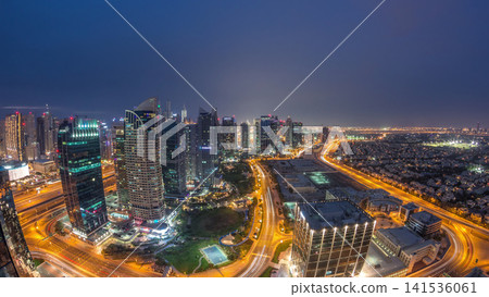 Jumeirah Lake Towers residential district aerial day to night timelapse near Dubai Marina Jumeirah Lake Towers residential district aerial day to night timelapse near Dubai Marina 141536061