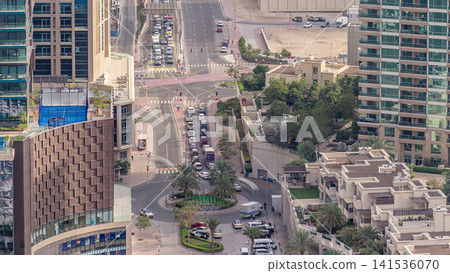 Aerial view of a road intersection in a big city timelapse. Aerial view of a road intersection in a big city timelapse. 141536070