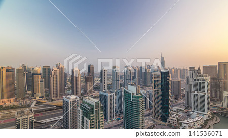 Aerial top view of Dubai Marina morning timelapse. Modern towers and traffic on the road Aerial top view of Dubai Marina morning timelapse. Modern towers and traffic on the road 141536071