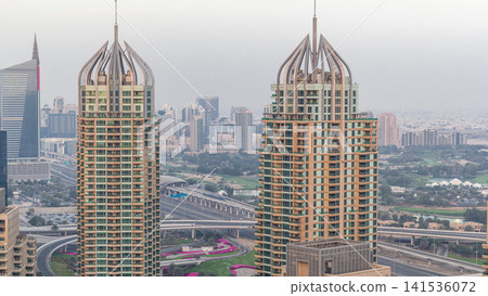 Aerial top view of Dubai Marina morning timelapse. Modern towers and traffic on the road 141536072