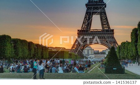 Eiffel Tower seen from Champ de Mars at sunset timelapse, Paris, France Eiffel Tower seen from Champ de Mars at sunset timelapse, Paris, France 141536137