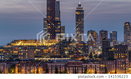 Aerial day to night timelapse of Katendrecht peninsula and Maashaven harbour in Rotterdam, The Netherlands. Aerial day to night timelapse of Katendrecht peninsula and Maashaven harbour in Rotterdam, The Netherlands. 141536223