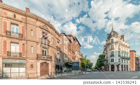 Panorama showing historic brick facades at Rue du Languedoc and Theodore Ozenne intersection timelapse in Toulouse, France. Panorama showing historic brick facades at Rue du Languedoc and Theodore Ozenne intersection timelapse in Toulouse, France. 141536241