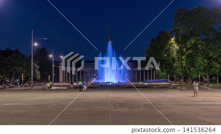 The heroes monument of the red army in schwarzenbergplatz day to night timelapse at night with colorful light fountain in vienna, austria The heroes monument of the red army in schwarzenbergplatz day to night timelapse at night with colorful light fountain in vienna, austria 141536264