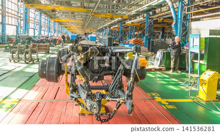 Conveyor assembly stage the body of tractor at big industrial factory timelapse 141536281