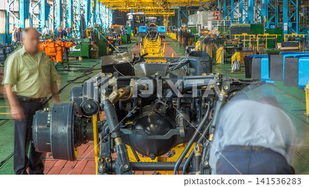 Conveyor assembly stage the body of tractor at big industrial factory timelapse 141536283