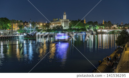 Torre del Oro day to night timelapse on Guadalquivir River in Seville, Spain Torre del Oro day to night timelapse on Guadalquivir River in Seville, Spain 141536295