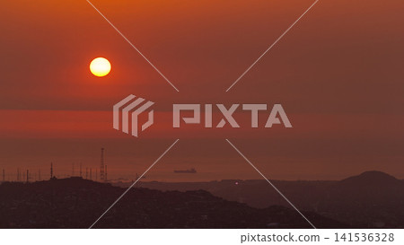 Aerial view of the Pacific ocean during sunset timelapse from Cerro San Cristobal, Lima 141536328