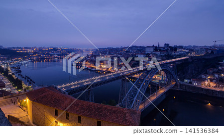 Day to Night view of the historic city of Porto, Portugal timelapse with the Dom Luiz bridge Day to Night view of the historic city of Porto, Portugal timelapse with the Dom Luiz bridge 141536384