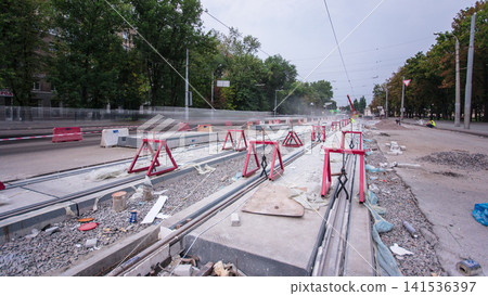 Road construction site with tram tracks repair and maintenance timelapse. Road construction site with tram tracks repair and maintenance timelapse. 141536397