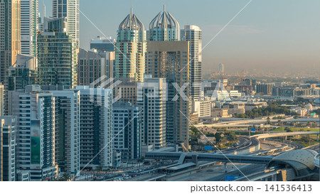 Dubai Marina skyscrapers aerial top view at sunrise from JLT in Dubai timelapse, UAE. Dubai Marina skyscrapers aerial top view at sunrise from JLT in Dubai timelapse, UAE. 141536413